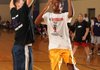 Benaiah Proctor, right, a Holt Middle School seventh-grader, reaches to score a basket around Andrew Chance, sixth-grade reading and writing teacher, during an afternoon of basketball games Dec. 21, the final day of the fall semester.

