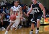 Rogers Heritage’s Forrest Johnson, left, makes a drive around Jacob Hall of Pea Ridge High School on Dec. 8 during round one of the Arvest Hoopfest basketball tournament at Rogers High School.