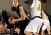 Bentonville’s Whitney Sandmann, left, drives a lane to the basket Thursday under pressure from Purdy’s Mattie White during the Lady Tigers’ game against the Lady Eagles in the Neosho Holiday Classic in Neosho, Mo.