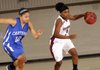 Springdale’s Baiyinnah Taylor drives the ball Friday past Carthage’s Kaylee Morgan during the Lady Bulldogs’ game against the Lady Tigers in the Neosho Holiday Classic in Neosho, Mo.