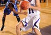 Kile Graves, Fayetteville senior, right, scores past Oklahoma City Southeast’s Roemello Roberson during the first half of play Dec. 16 at Fayetteville High.