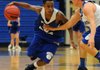 Xavier Smith, left, tries to get around Keifer Holt during the Mounties’ Blue-White Night scrimmage Nov. 8 at Rogers High School.