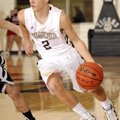 Collin Roberts, Bentonville junior guard, drives the ball Dec. 21 against Pea Ridge at Tiger Arena i...