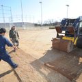 Mike Thompson, a representative for Easton Sod Farm in Bixby, Okla., operates a skid-steer loader We...