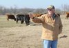 Ron Morrow describes several methods he uses while rotating his cattle Dec. 16 across land he leases in Prairie Grove.