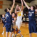 Prairie Grove’s Marcus Patterson, center, leaps to score in the lane as Shiloh Christian’s Darian Ha...