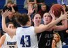 Rogers High’s Hannah Davidson, left, and Samantha Warren, center, close in on Morgan Miller of Siloam Springs High School on Tuesday at King Arena in Rogers. The Lady Mountaineers won the game over the Lady Panthers of Siloam Springs, 67-35.