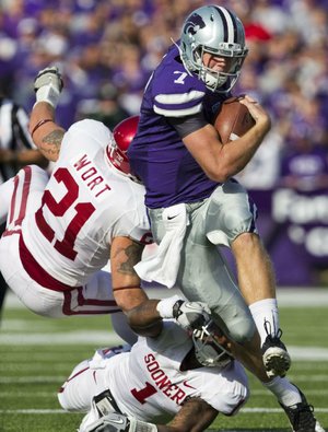 Kansas State quarterback Collin Klein (above) and Arkansas quarterback Tyler Wilson do things in different ways, but both have steered two major conference schools to 10-2 records and a ranking in the Bowl Championship Series top 10. They will go head-to-head Friday in the Cotton Bowl.