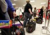 Customers wait to check out at a Kohl’s department store in La Habra, Calif., in November. Many retailers reported solid gains for December, capping a decent Christmas season. 