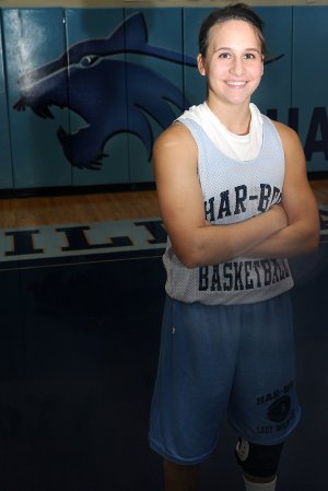 Ashley Gray, Springdale Har-Ber, has to practice with the support of a knee brace on her left leg after suffering a torn anterior cruciate ligament last year.
