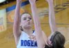 Sarah Grace Groves, Rogers High School, left, shoots over Siloam Springs High School’s Morgan Miller Tuesday at King Arena in Rogers. The Lady Mounties beat the Lady Panthers 67-35.
