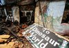 The charred remains of the building at the closed Dinosaur World is seen on Tuesday, Aug. 9, 2011, near Beaver Lake. The building was destroyed by fire the week prior. In 1967 Ola Farwell began the ambitious project, “building it for the children of the Ozarks and the county, to give them something entertaining and educational.” He hired Emmet Sullivan, sculptor of the nearby Christ of the Ozarks statue, to create a number of dinosaurs, cavemen and other prehistoric creatures on several acres near Beaver Dam. In 1972 the cost of admission to Dinosaur World was $1 for adults and 50 cents for children. Visitors could see a 22-feet-tall Tyrannosaurus Rex, a saber-toothed tiger and cavemen hunting a bison, all made from reinforced concrete. The park fell on hard times in later years and closed. In 2010 it was listed as one of America’s “10 Most Endangered Roadside Places.”
