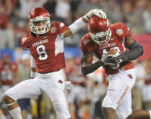 Arkansas Democrat-Gazette/MICHAEL WOODS --01/06/2012-- University of Arkansas defenders  Tevin Mitchel and Tenarius Wright celebrate after Kansas State quarterback Collin Klein fumbled the ball  in the first quarter of Friday nights game at the 2012 Cotton bowl at Cowboy Stadium in Arlington