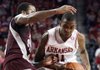 Arkansas' B.J. Young drives against Mississippi State's Dee Bost Saturday, January 7, 2011 at Bud Walton Arena in Fayetteville.