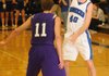 Josh Anderson, a Rogers guard, passes around Fayetteville’s Kile Graves at King Arena in Rogers on Tuesday.