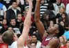 Alex Rice, left, of Springdale Har-Ber tries to block Springdale High’s D.J. Evans as he takes a shot Tuesday at Wildcat Arena in Springdale.