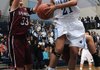 Summer Morgan, right, of Springdale Har-Ber goes up for a shot Tuesday as Courtnie Miller of Springdale High defends at Wildcat Arena in Springdale.