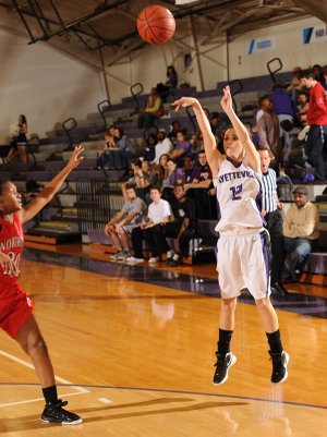 Hailey Young, a Fayetteville senior guard, shoots a 3-pointer in front of Fort Smith Northside junior guard Bria Caldwell. Fayetteville will travel to Rogers Heritage tonight for a 7A-West Conference clash.
