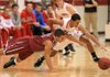 Arkansas Democrat-Gazette/STATON BREIDENTHAL -- Cabot's Jordan Brunett (right) and Springdale's Tony Dennis scramble for a loose ball during a December game. Cabot will host the 2012 Class 7A State Tournament. 