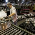 Jason Lilly picks up one of 15 styles of aluminum wheels being packed at Superior Industries in Faye...