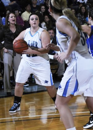 Krista Murr of Springdale Har-Ber looks for a teammate on Friday while hosting Rogers High in Springdale.
