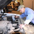 Lonnie Phelps of Benton County’s Road Department checks the engine fluid levels Friday of a county-o...