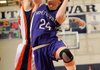 Fayetteville’s Sarah Smith, right, takes the ball to the basket under pressure from Rogers Heritage’s Lindsey Wood during their game Friday in Rogers.
