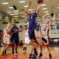 Fayetteville’s Aubrey Edie, center, takes the ball to the basket in front of Rogers Heritage’s Raya ...