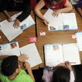Third-grade students in Holly Ownbey’s class at Tyson Elementary School work on their cursive handwr...