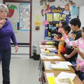 Karen Rogers works her fifth-graders through an exercise practicing writing cursive in the air Frida...