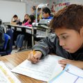 David Mercado, 10, a fifth-grader in Karen Rogers’ class at Tyson Elementary School works Friday on ...