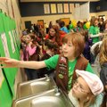 COOKIE CONVENTION Maddisen Garrett, 9, center, a Brownie with Happy Hollow Elementary School Girl Sc...