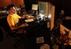 Trey Marley, associate producer for the Pryor Center for Arkansas Oral and Visual History at the University of Arkansas, edits video Friday for a project the center is working on in Fayetteville.

