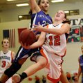Brittany Ward, Rogers Heritage, front, takes the ball to the basket under pressure from Fayetteville...