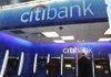 A man uses a Citibank automated teller machine in New York on Jan. 6. Citigroup said Tuesday that profit fell 11 percent in the fourth quarter. 