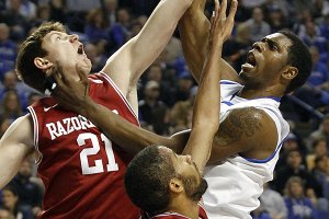 Kentucky’s Terrence Jones (right) shoots over Arkansas defenders Hunter Mickelson (21) and Marvell Waithe during the first half of the No. 2 Wildcats’ 86-63 victory over the Razorbacks on Tuesday at Rupp Arena in Lexington, Ky. Jones finished with 13 points and nine rebounds.