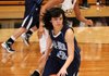 Jessica Olson, a Springdale Har-Ber guard, starts a drive down court against the Lady Tigers in Bentonville on Tuesday.