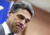 Texas Gov. Rick Perry pauses while announcing Thursday in North Charleston, S.C., that he is bowing out of the GOP presidential campaign. 