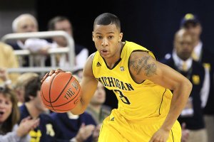 Trey Burke had 20 points and a key assist in Michigan’s 60-59 victory over Michigan State on Tuesday. 