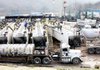Workers check the sand flow at a Southwestern Energy Co. natural-gas production site in Camptown, Pa., last fall. 