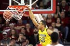 Michigan forward Jordan Morgan dunks against Arkansas during Saturday’s game at Walton Arena in Fayetteville. Morgan finished with 16 points as the Wolverines found their rhythm in the second half and reduced Arkansas’ 20-point lead to a two-point victory. 