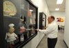 Bill Mathews, local McDonald’s franchise owner, shows off some McDonald’s memorabilia as he gives a tour of the new training center Jan. 11 in Springdale.
