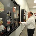 Bill Mathews, local McDonald’s franchise owner, shows off some McDonald’s memorabilia as he gives a ...