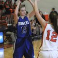 Sarah Grace Groves, Rogers High, tries to work the ball around Heritage’s Brittany Ward on Friday at...