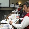 Randy Lawson, a NorthWest Arkansas Community College trustee, looks over a map of the student center...