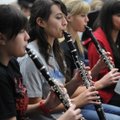 PRACTICE MAKES PERFECT Bethany Harper, center, a junior at Fayetteville High School, plays the clari...