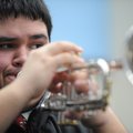BAND CLINIC  Issac Pritchett, a junior at West Fork High School, plays the trumpet along with other ...