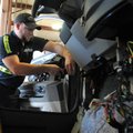 Eil Keffer, lead technician for Ozark Regional Transit, works Thursday on fixing a bus wiring issue ...