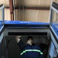 Kevin Holtz installs a new motor for the doors of a bus Thursday at Ozark Regional Transit’s mainten...
