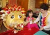 Kammy Krisell, 39, of Sherwood, made this papier-mache dragon head for her 3-year-old daughter Mari-Grace’s Lunar New Year celebration tonight. 